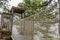 Rustic rope bridge leading to a wooden hut platform