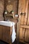 Rustic, rough style wooden board plank door, bathroom interior