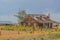 A rustic, rundown, old abandoned, ruined, farm house in the countryside of a prairie in Colorado