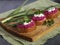 Rustic sandwiches. Ethnic food, Beetroot hummus with parsley and green onions Vegetarian food, sandwiches. Healthy eating