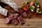 Rustic snack, unhealthy but delicious salami combined with healthier foods