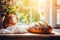 Rustic sourdough bread closeup on wooden board in sunlit kitchen with window backdrop