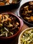 Rustic spiced, roasted cauliflower with roasted vegetables in natural light