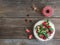 Rustic spicy ginger cake with cream-cheese filling and fresh strawberries over a rough wood background with a copy space