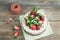 Rustic spicy ginger cake with cream-cheese filling and fresh strawberries with a rough wood background