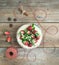 Rustic spicy ginger cake with cream-cheese filling and fresh strawberries with a rough wood background