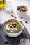 Rustic spinach and broccoli rich soup puree with cream and croutons