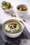 Rustic spinach and broccoli rich soup puree with cream and croutons