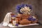 Rustic still life. milk and bread with flowers. chamomiles and cornflowers in a basket