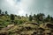 Rustic stone house on a hilly landscape