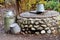 Rustic stone well, can and bucket