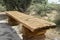 Rustic strongly structured old bench as solid wood as a resting place for hikers in the heath, Germany