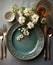 Rustic table with porcelain tableware, glasses, vases and white flowers in green tones