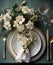 Rustic table with porcelain tableware, glasses, vases and white flowers in green tones