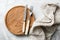 Rustic table setting with vintage silverware, wooden board and textile