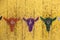 Rustic target background - for archery - stencil cow heads in different colors with bullseyes on foreheads on grungy yellow boards