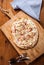 Rustic Thin Crust French Pizza on Wooden Cutting Board