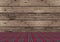 Rustic tradional wooden Christmas background with red and green plaid pattern ground