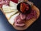 Rustic Tuscan tray with typical products: prosciutto ham, brawn, finocchiona, crostini, salami, tuscan chilli and sliced pecorino