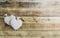 Rustic Valentines day background with toy hearts over wooden table. Place for text