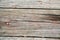 Rustic weathered planks with knots and nail