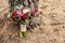 Rustic wedding bouquet with red rose nearly pine tree with cope