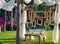 Rustic Wedding Photo booth Set-up outside. Wooden bench with hanging wooden frames as background