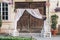 rustic wedding photo zone. wooden barn doors with fabric and white boxes with flowers and candles at stylish wedding photo booth.