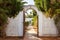 rustic whitewashed gate of a spanish revival house