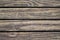 Rustic wood planks closeup. Rough lumber surface. Warm brown wooden background for vintage card