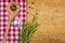 Rustic wooden background with a checkered tablecloth