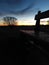 Rustic wooden bench illuminated by the sunset