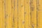 Rustic wooden old flaked  yellow painted texture of planked wall pattern