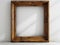 Rustic wooden picture frame mockup against a white wall