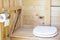 Rustic, wooden restroom WC with a modern toilet seat and paper on the holder