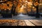 A rustic wooden table against a radiant autumn maple tree bokeh backdrop