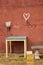 Rustic wooden table and broom and white heart