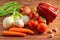 Rustic wooden table displaying a variety of fresh vegetables