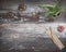 Rustic wooden table with green plant, burning incense, small energy healing stones and Tibetan meditation prayer bells