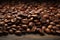 Rustic wooden table hosts a close up of aromatic coffee beans