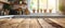 A Rustic Wooden Table Sits Against A Blurred Kitchen Backdrop Simplistic Elegance