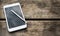 Rustic wooden table with smartphone. View from above