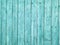 Rustic wooden wall, turquoise color. Retro style background. Weathered paint with many cracks