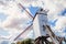 Rustic wooden windmills in idyllic Bruges public park, Belgium