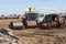 Rusting farm machinery in a field