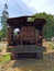 Rusting forestry equipment in green field