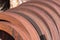 Rusting train wheels stacked in siding