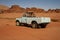 Rusty abandoned truck in the middle of desert