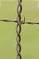 Rusty Barbed Wire Fence Intersection Close-up