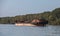 Rusty barge is anchored on the Danube river